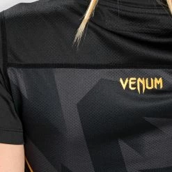 Venum Razor Dry Tech T-Shirt - For Women - Black/Gold 11 Venum Razor Dry Tech T-Shirt - For Women - Black/Gold -Venum store 1 252F9 252F9 252F5 252F199578554f508e1957cbf331b2e837f08367a43c 41 3cfe2a98 17dd 4454 a8e3 25aa37d7acbe