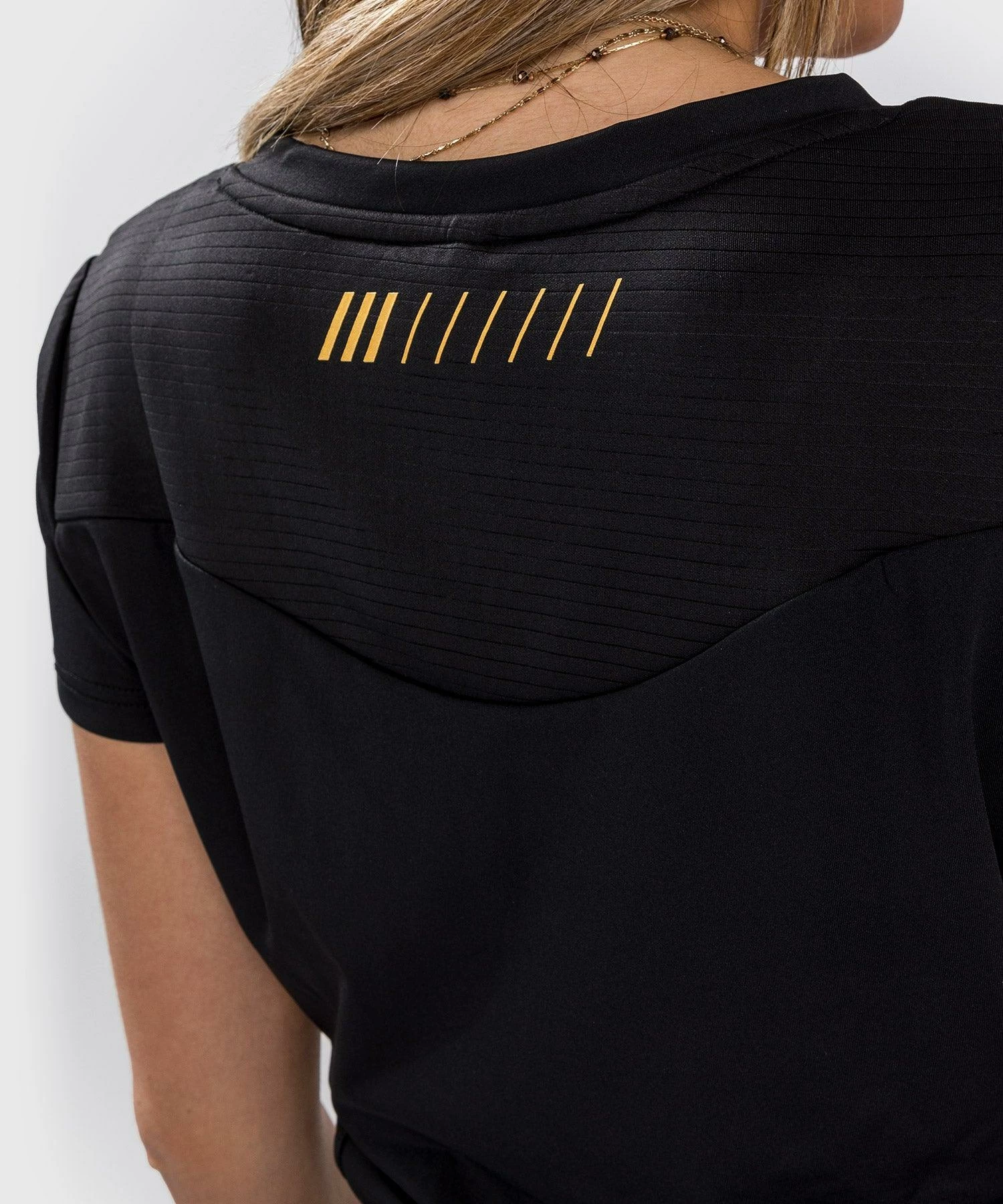 Venum Tempest 2.0 Women's Dry Tech T-shirt - Black/Gold 7 Venum Tempest 2.0 Women's Dry Tech T-shirt - Black/Gold - Image 7